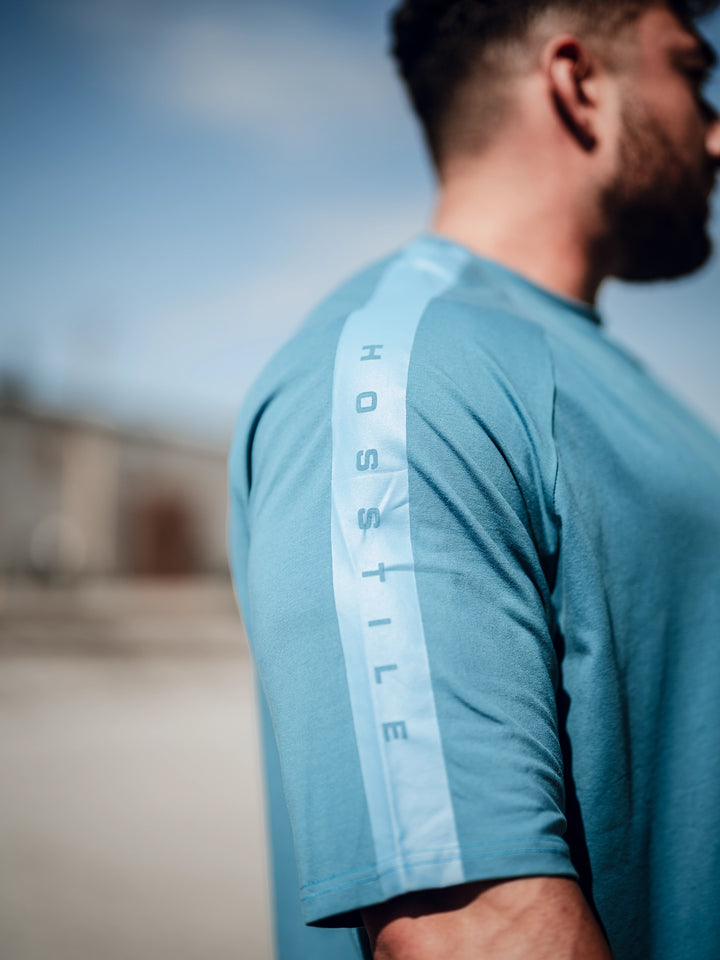 Bodybuilder wearing an oversized workout t-shirt