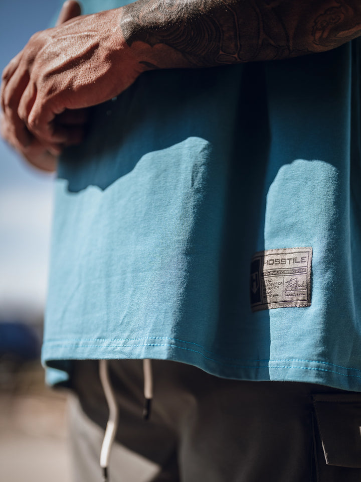 Bodybuilder wearing an oversized workout t-shirt
