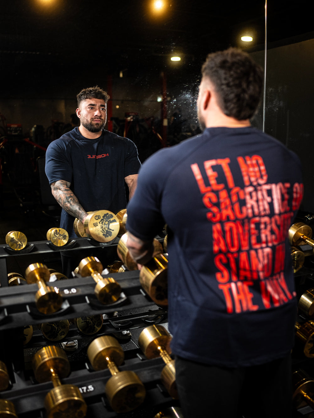 Bodybuilder wearing the Bodybag Oversized Tee#color_navy-red