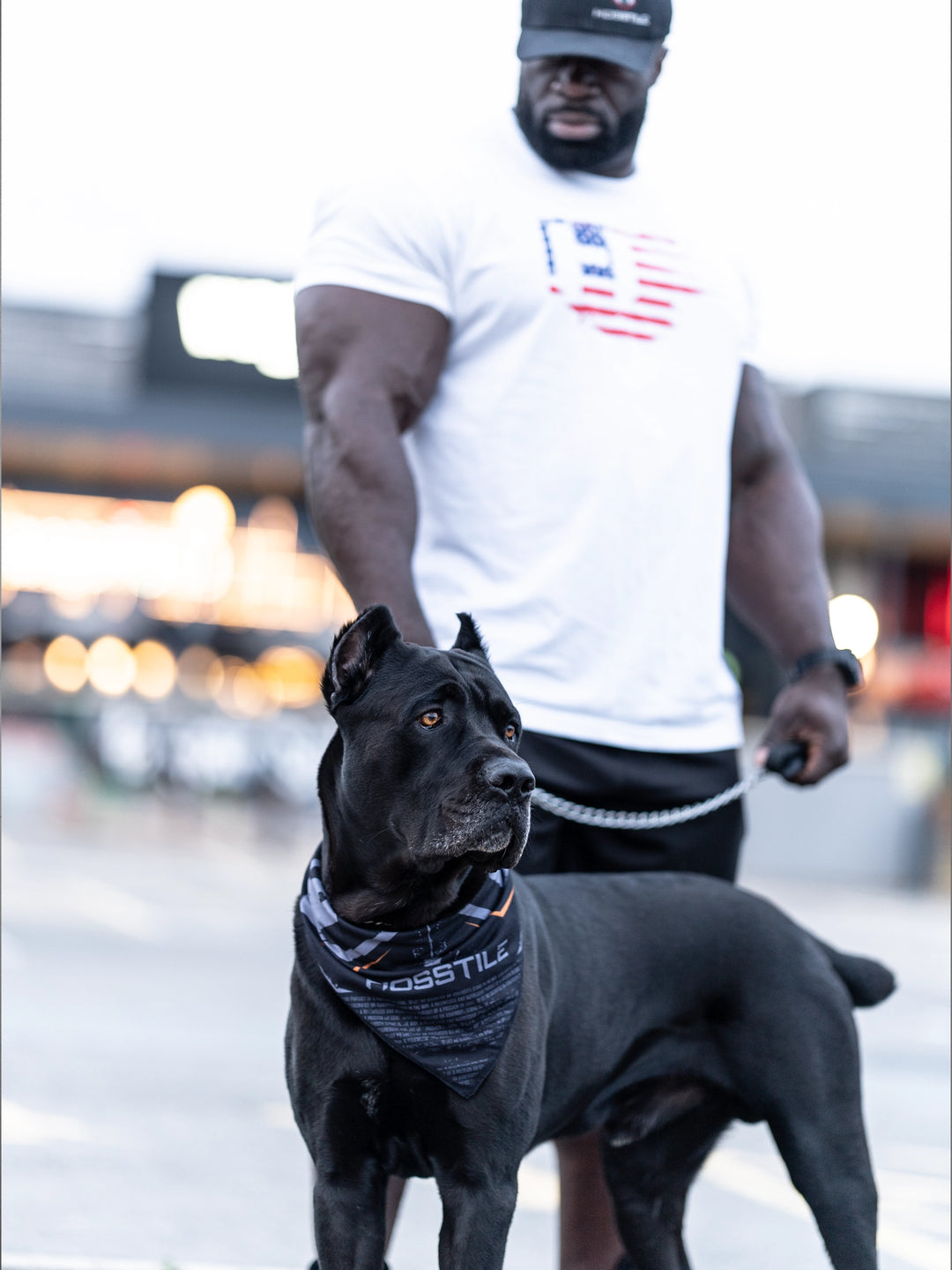Bodybuilder Samson Dauda with dog wearing bandana