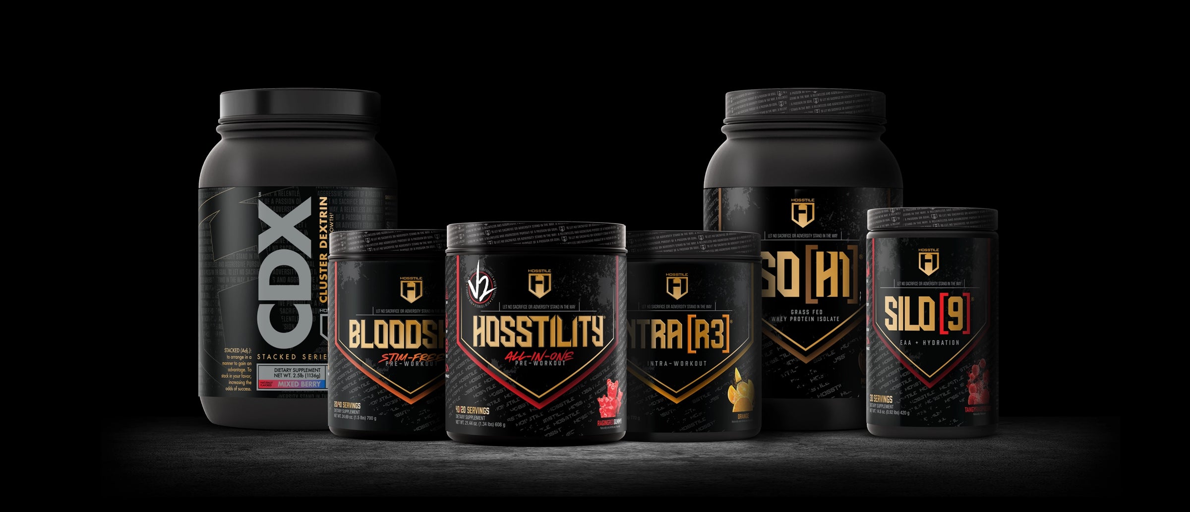 Collection of hosstile supplement containers with visible branding on a dark background