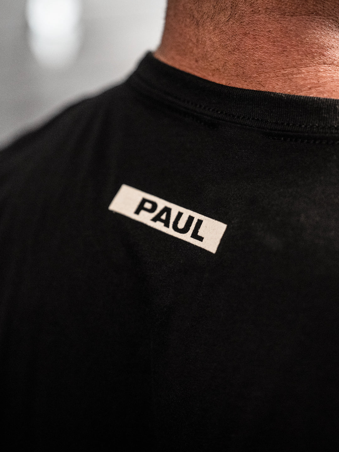 Paul Lauzon wearing the Brolationship Tee in Black#color_black