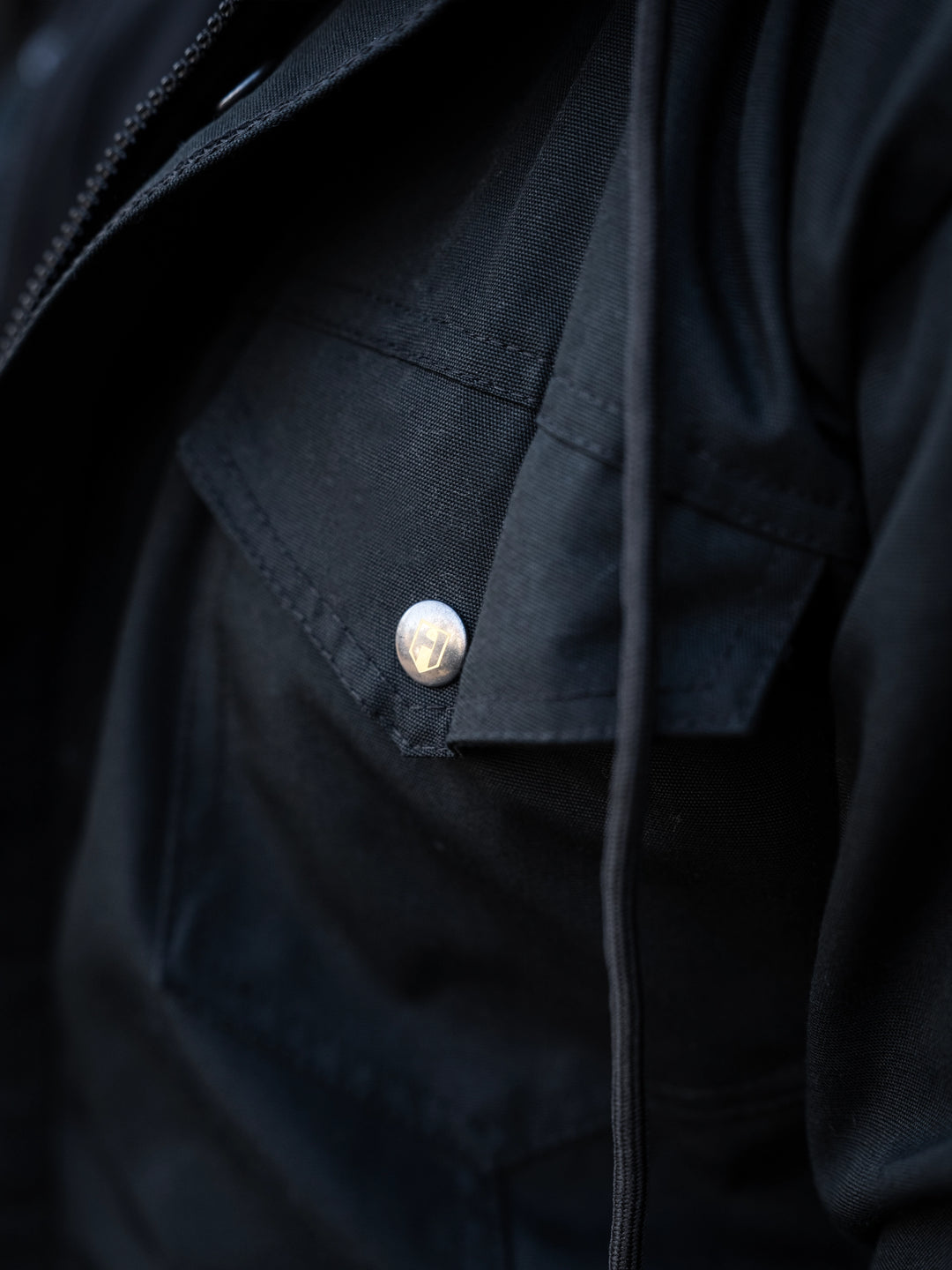 Bodybuilder wearing the Canvas Work Jacket#color_black