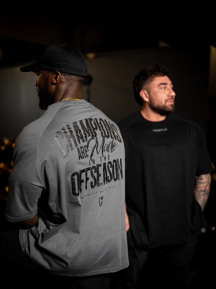 bodybuilder wearing Champion Oversized Tee#color_gunship-grey