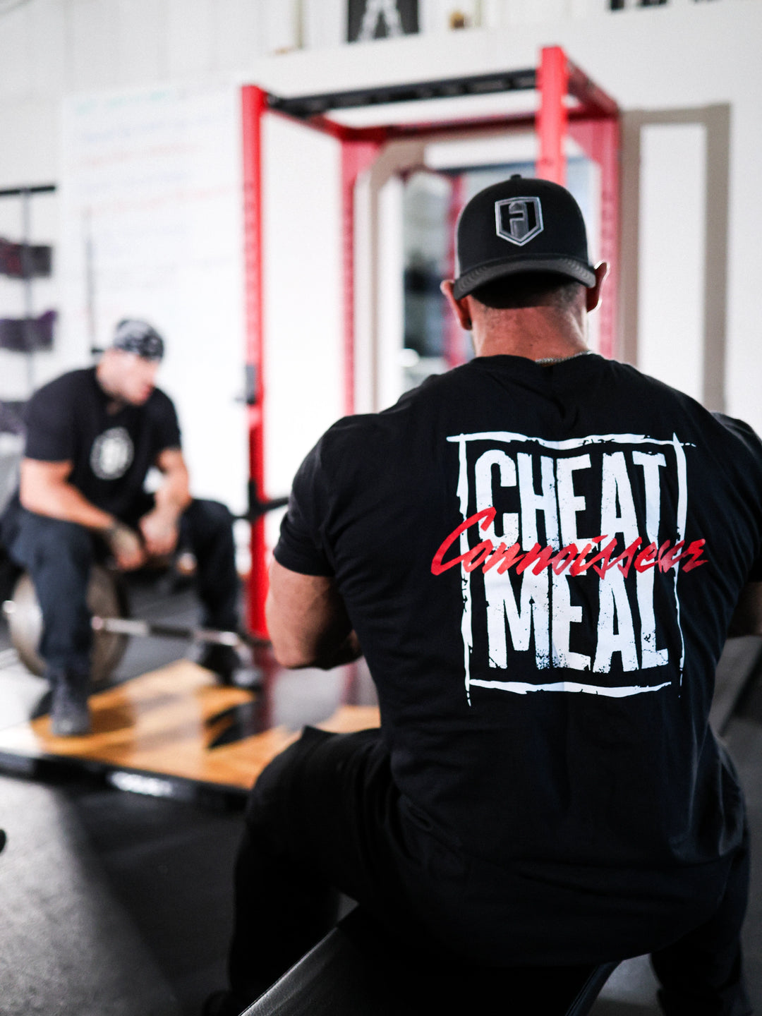 Bodybuilder wearing the Cheat Meal Tee in Gymt#color_black