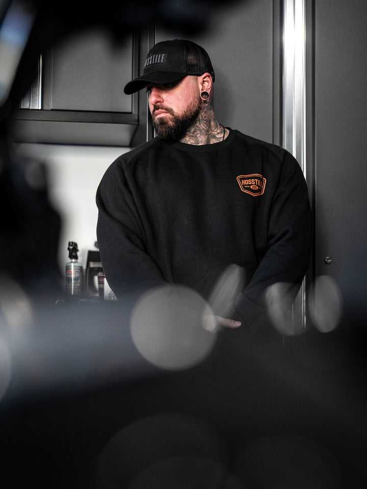Bodybuilder wearing the Hosstile Club Crew Sweatshirt#color_black