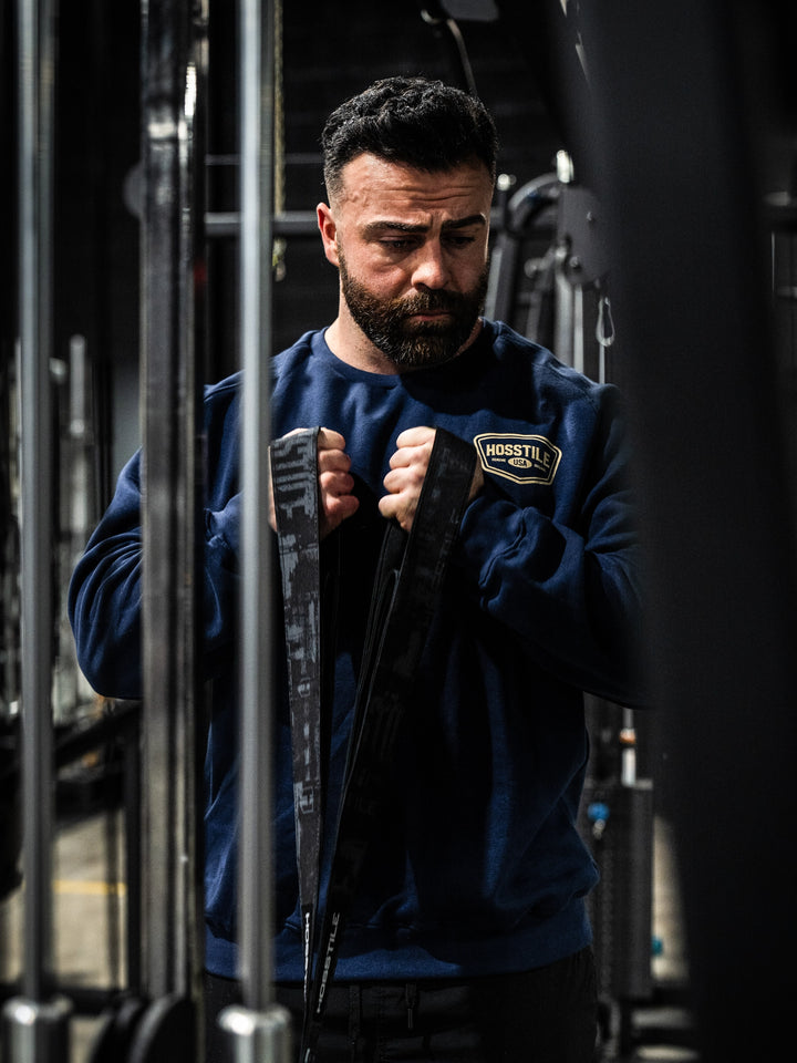 Bodybuilder wearing the Hosstile Club Crew Sweatshirt#color_navy