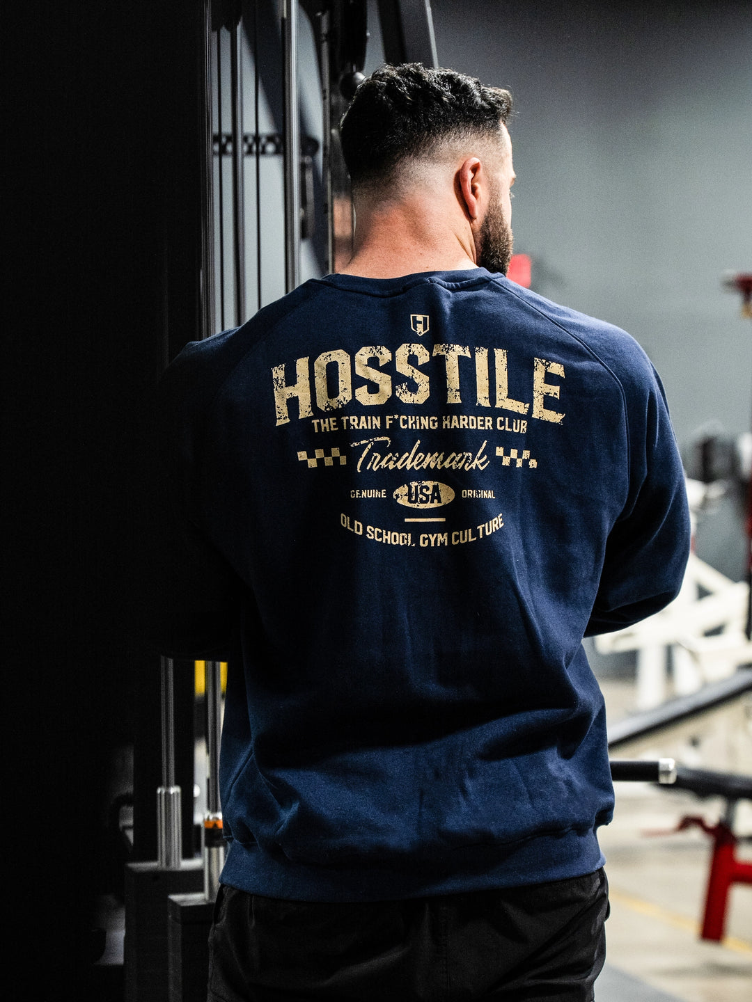 Bodybuilder wearing the Hosstile Club Crew Sweatshirt#color_navy