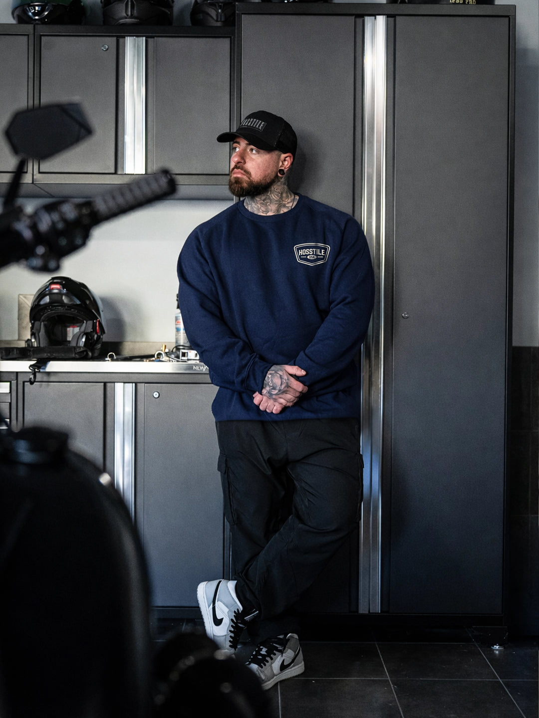 Bodybuilder wearing the Hosstile Club Crew Sweatshirt#color_navy