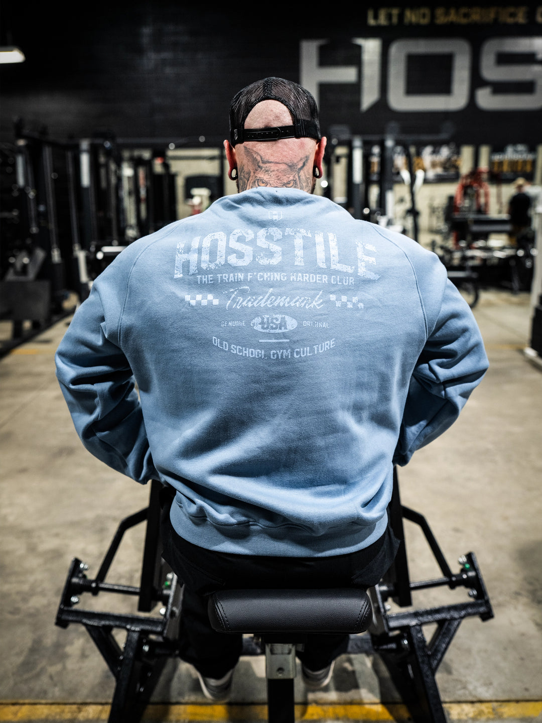 Bodybuilder wearing the Hosstile Club Crew Sweatshirt#color_smoke-blue
