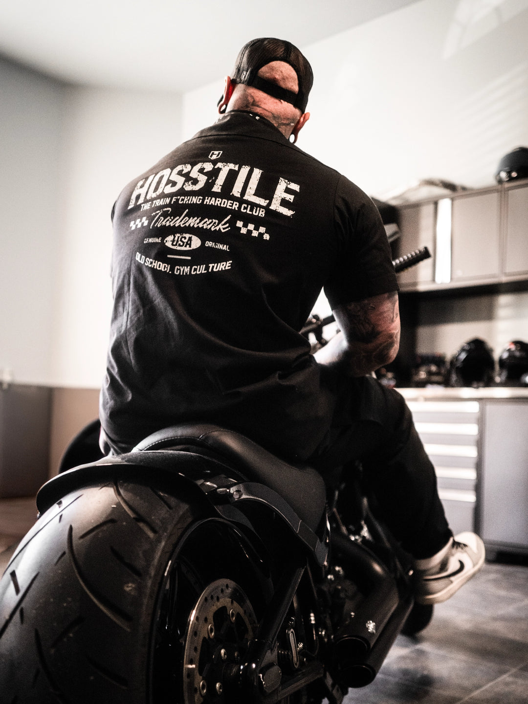 Man wearing the Hosstile Club Work Shirt in Black#color_black