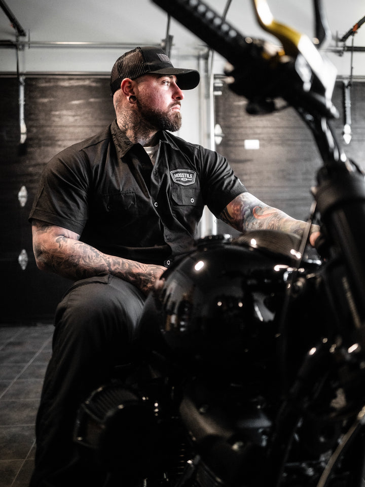 Man wearing the Hosstile Club Work Shirt in Black#color_black