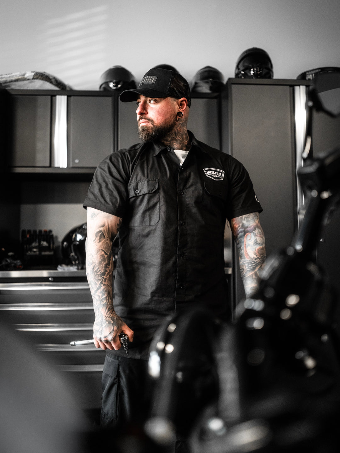 Man wearing the Hosstile Club Work Shirt in Black#color_black