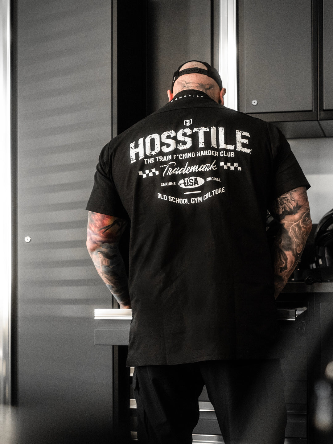 Man wearing the Hosstile Club Work Shirt in Black#color_black