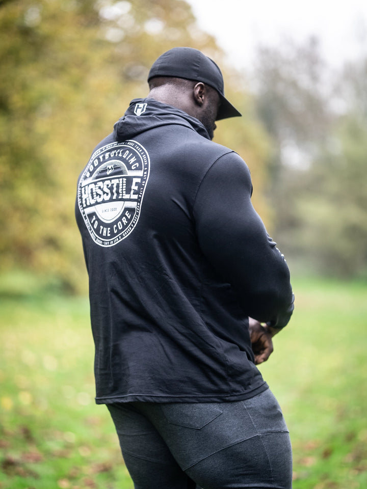 Bodybuilder Samson Dauda wearing the Core Pullover Hoodie#color_black