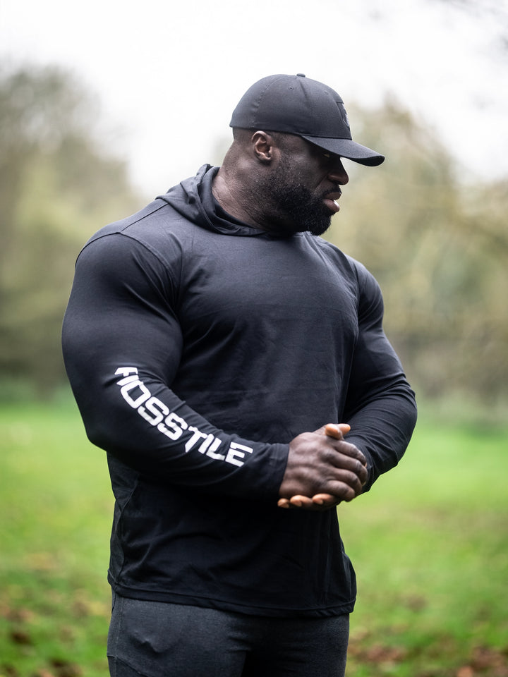 Bodybuilder Samson Dauda wearing the Core Pullover Hoodie#color_black