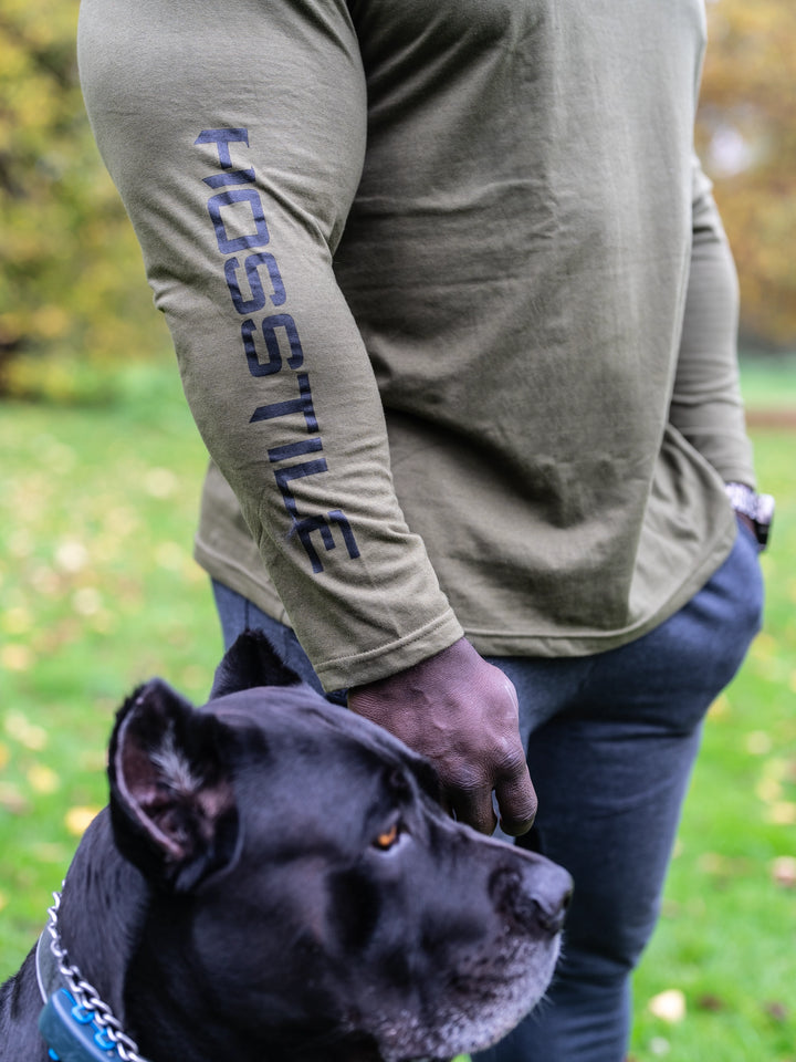 Bodybuilder Samson Dauda wearing the Core Pullover Hoodie#color_rifle-green