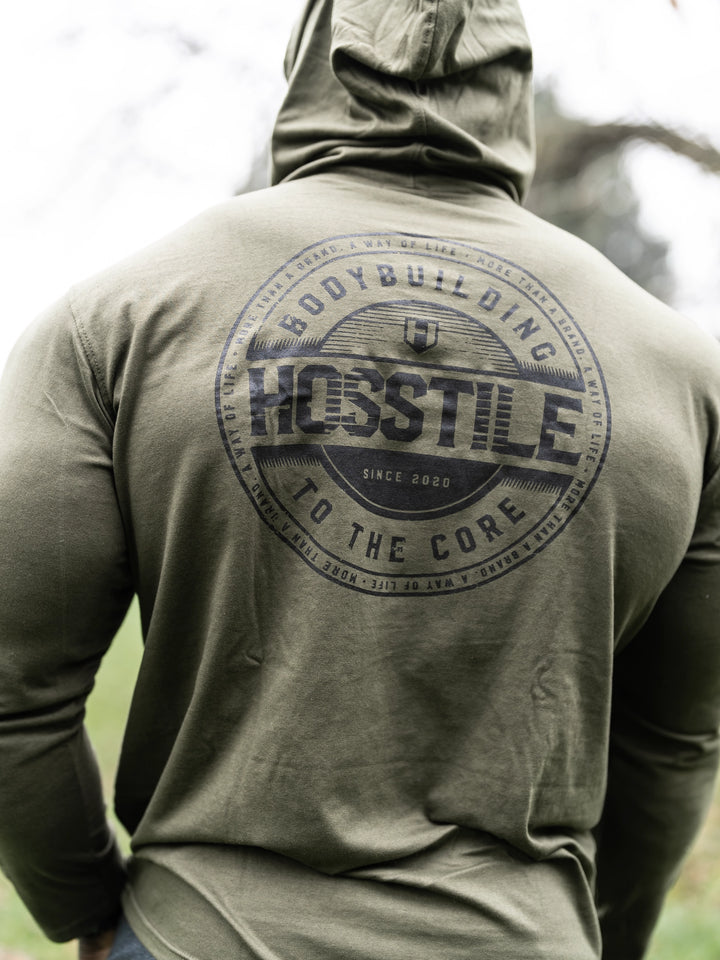 Bodybuilder Samson Dauda wearing the Core Pullover Hoodie#color_rifle-green