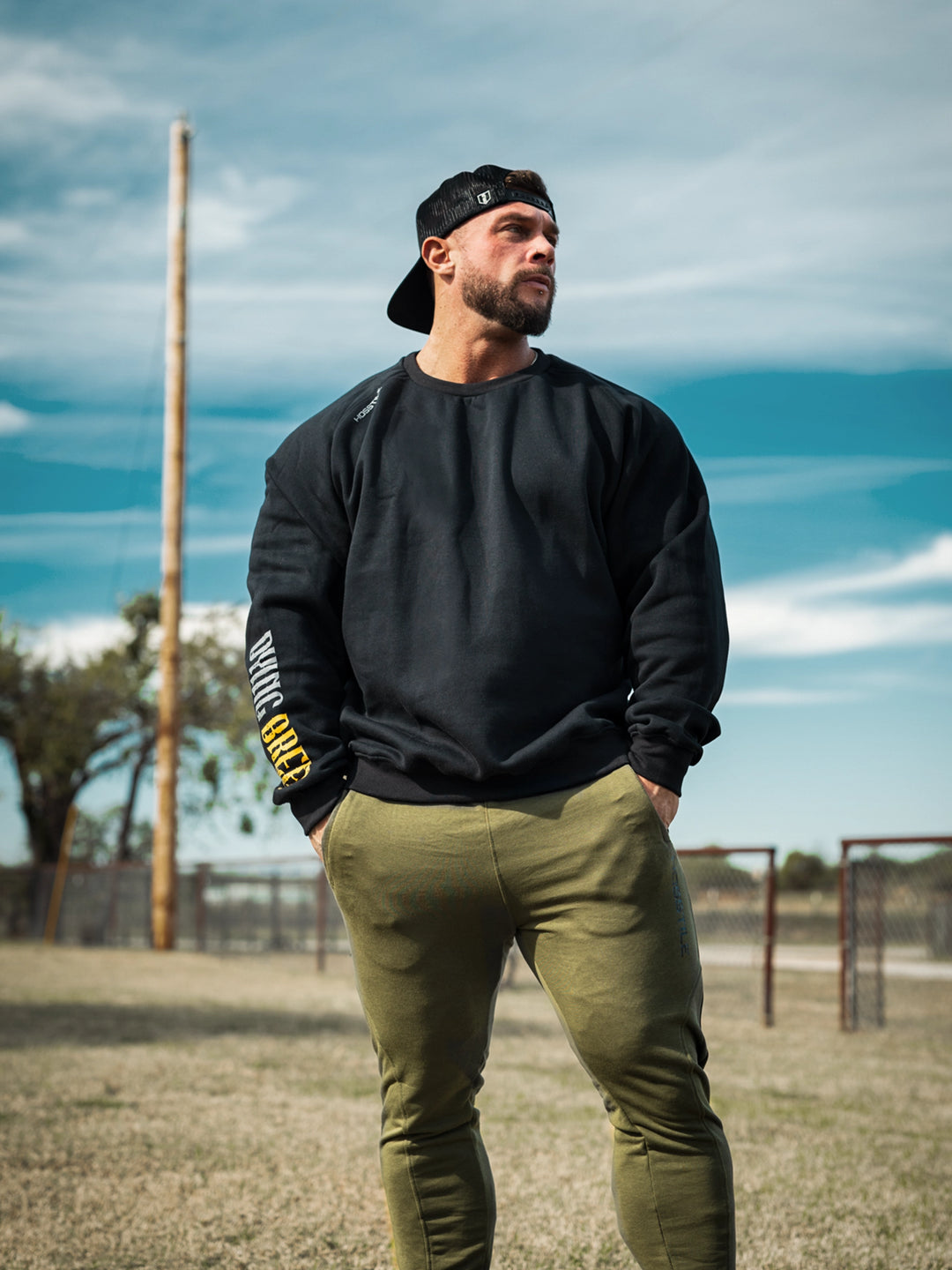 Bodybuilder wearing the Dying Breed Crew Sweatshirt#color_black