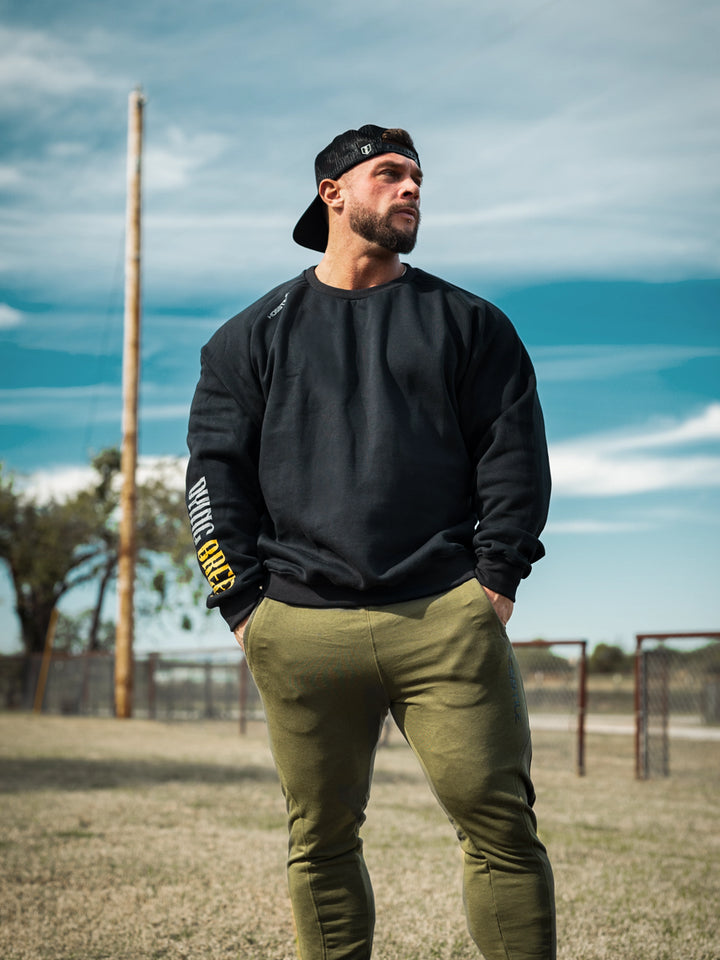 Bodybuilder wearing the Dying Breed Crew Sweatshirt#color_black