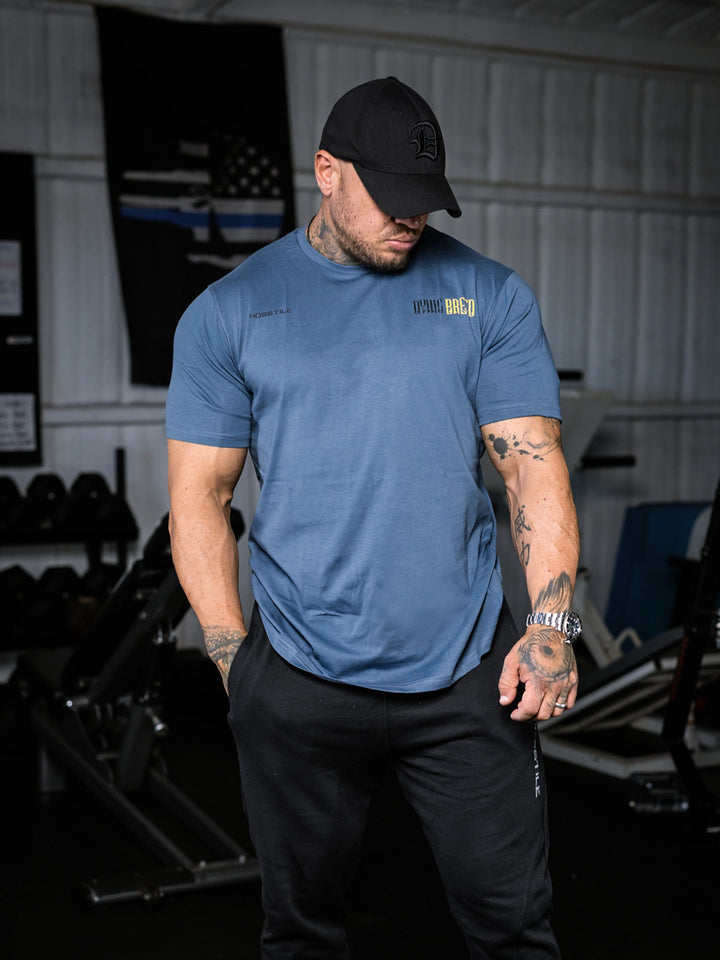 Bodybuilder wearing the Dying Breed Gym T-shirt#color_imperial-blue