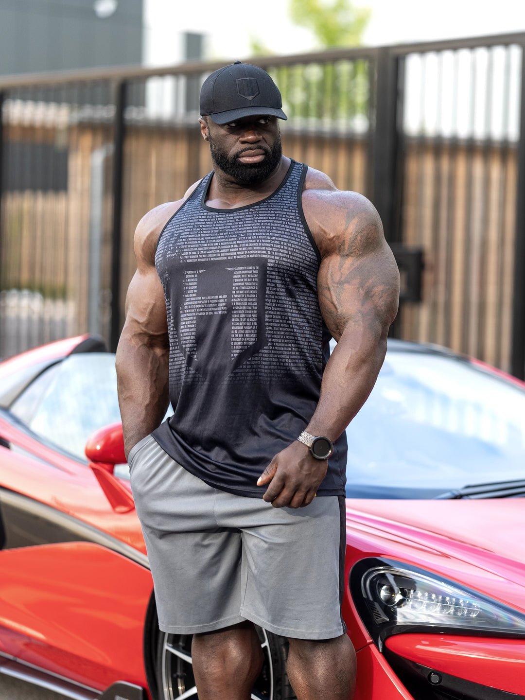 Bodybuilder Samson Dauda wearing the Dark Knight Long Body Tank Top