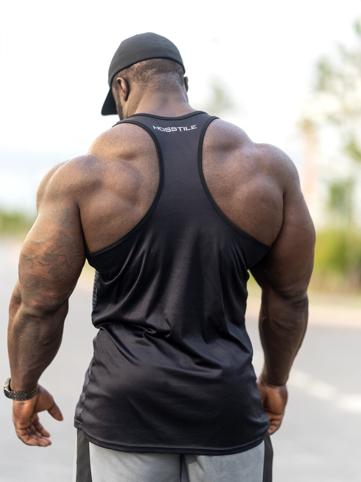 Bodybuilder Samson Dauda wearing the Dark Knight Long Body Tank Top