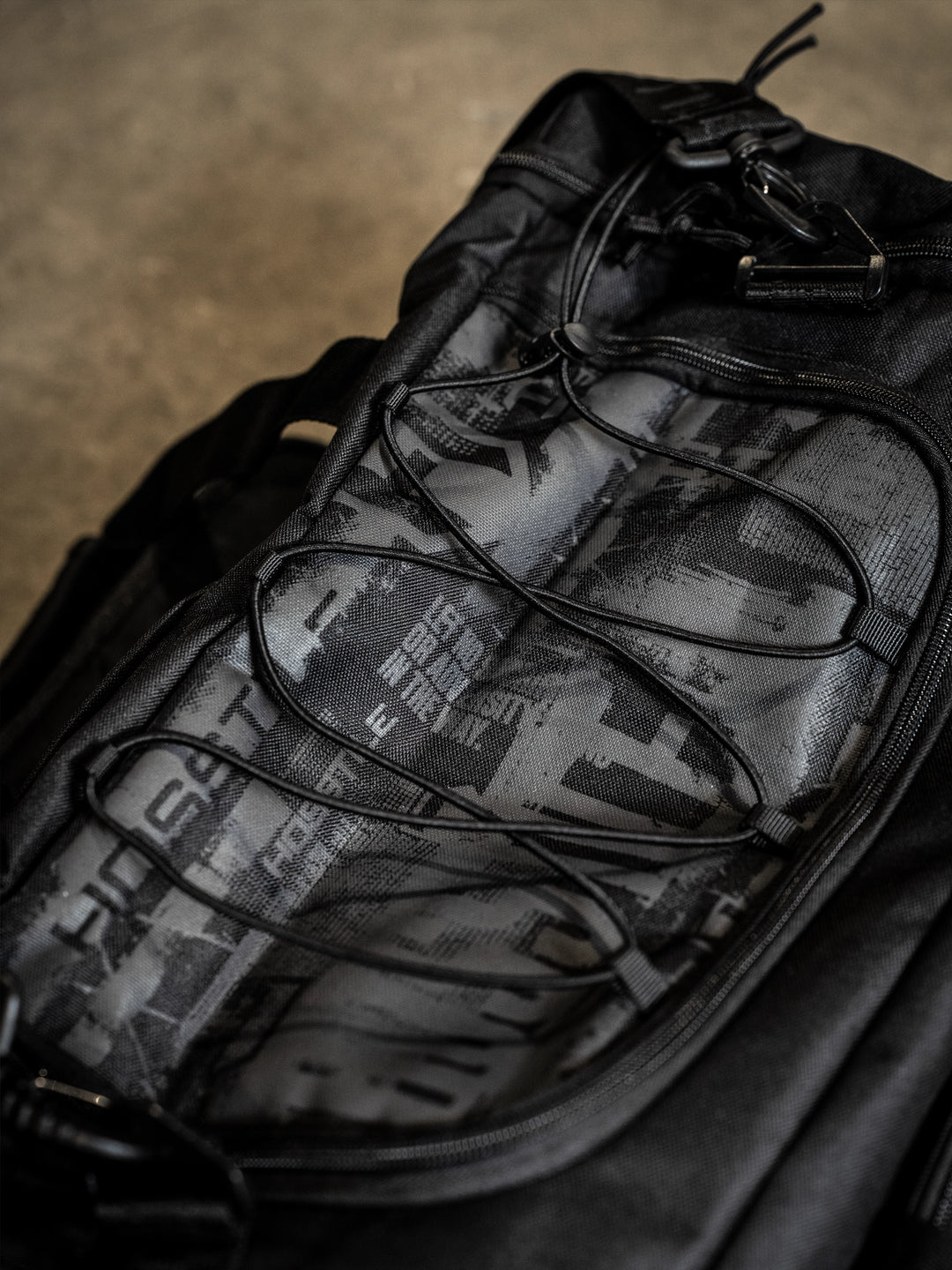 bodybuilder carrying the Hosstile Duffel Backpack in the gym