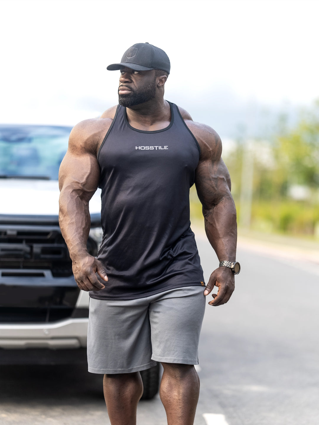 Bodybuilder Samson Dauda wearing the Echo Long Body Tank Top