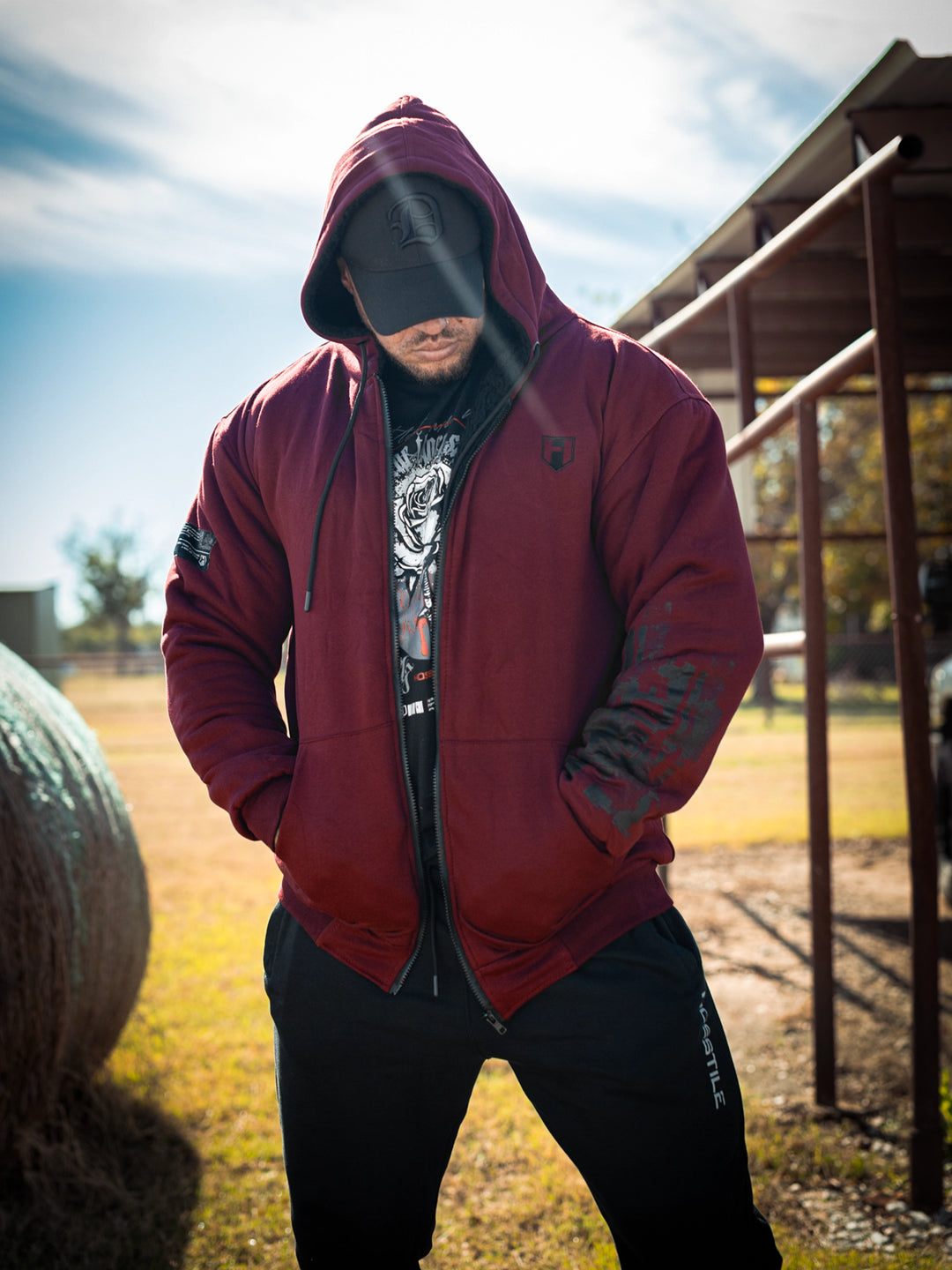 Bodybuilder wearing the Endure 2.0 Sherpa Hoodie#color_deep-cherry