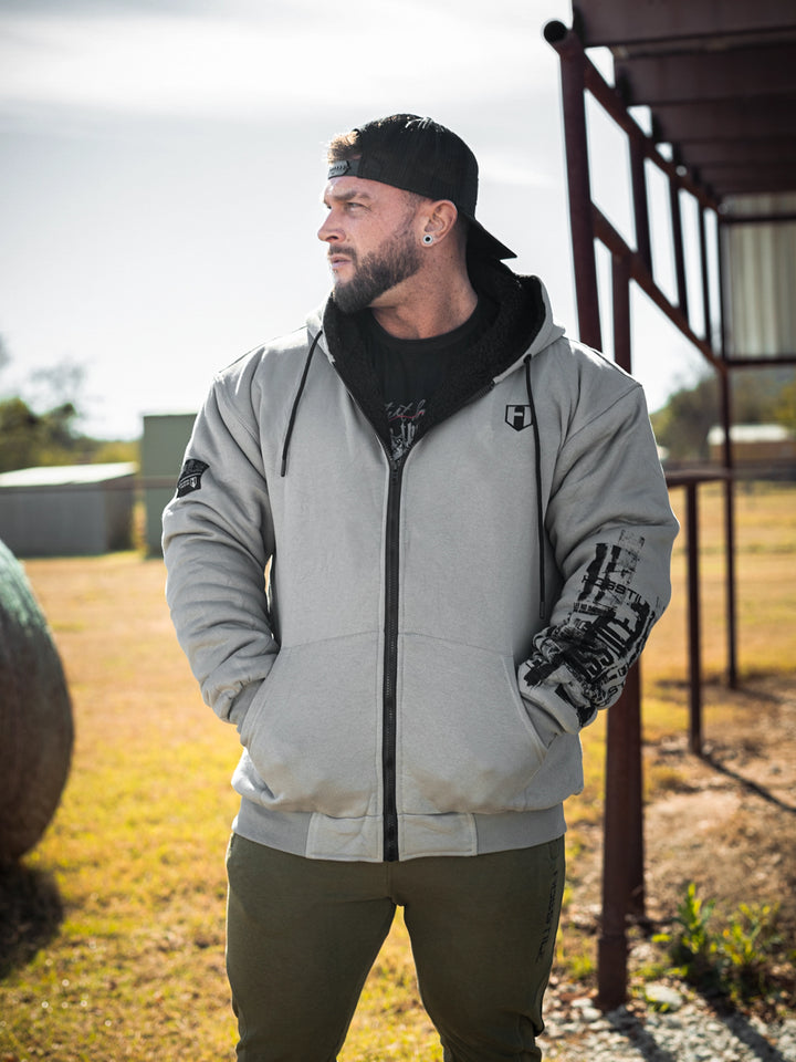 Bodybuilder wearing the Endure 2.0 Sherpa Hoodie#color_grey