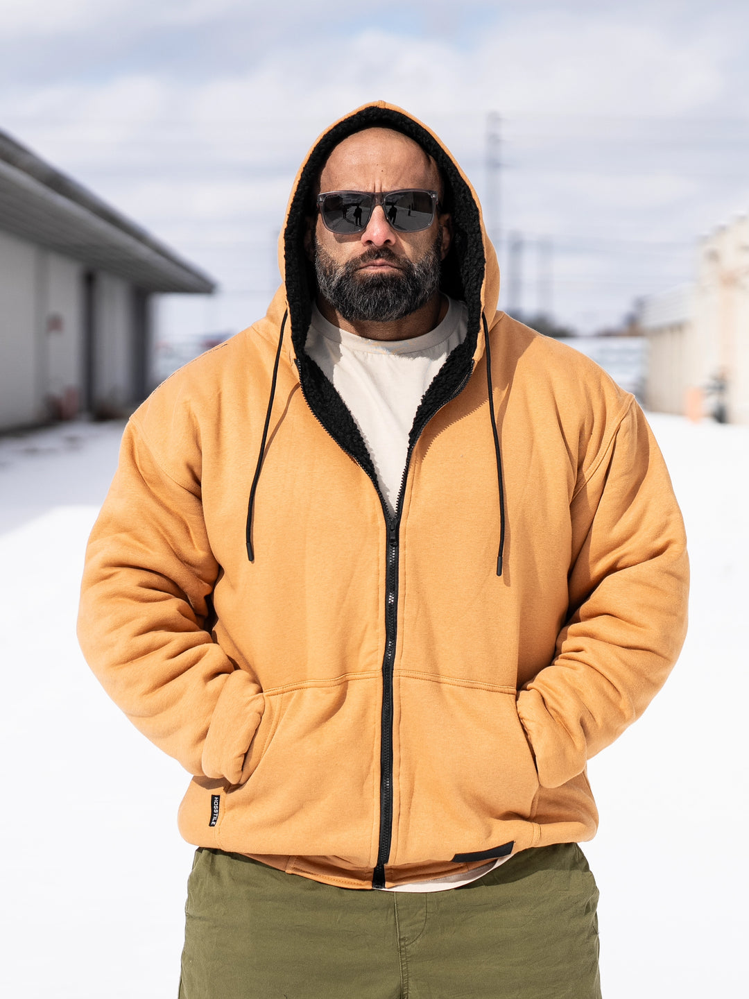 Bodybuilder Fouad Abiad wearing the Endure Sherpa-Lined Hoodie Outside#color_tundra