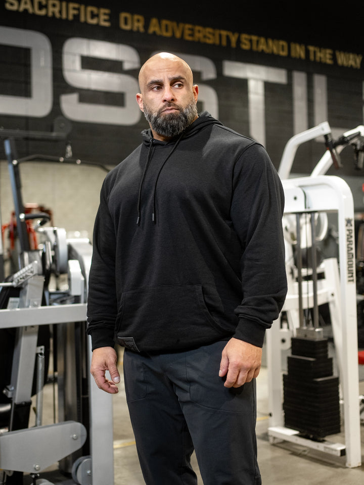 Bodybuilder Fouad Abiad wearing Ethos lightweight pullover hoodie#color_black