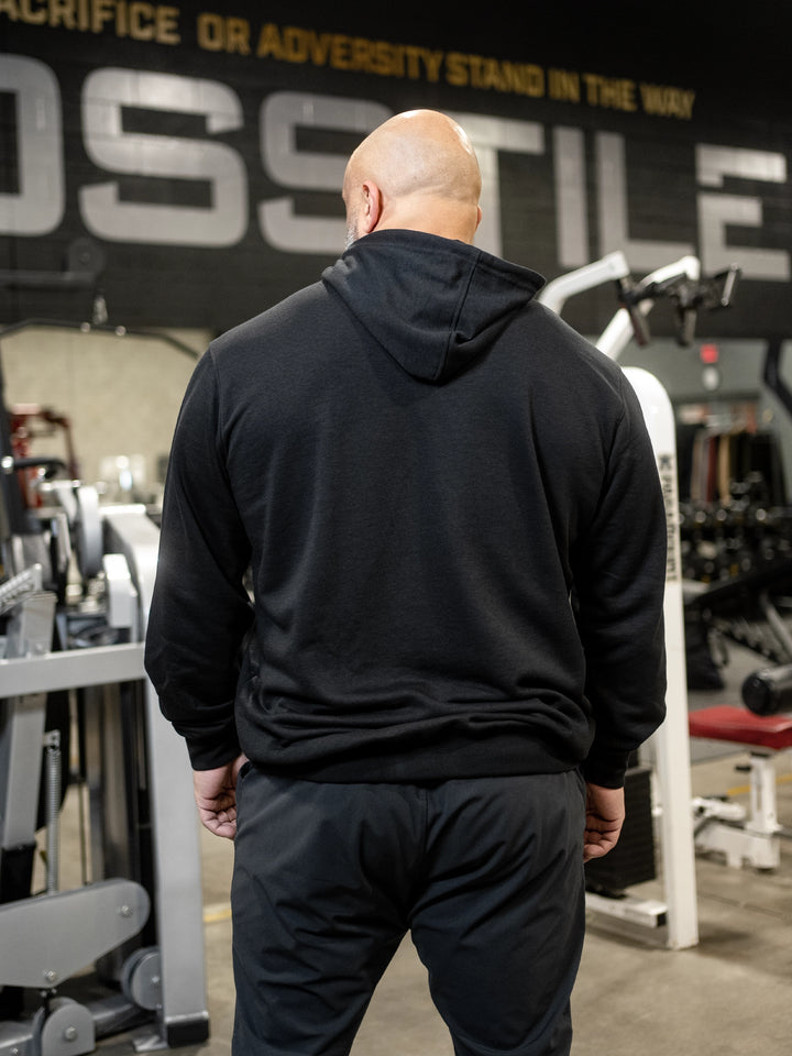 Bodybuilder Fouad Abiad wearing Ethos lightweight pullover hoodie#color_black