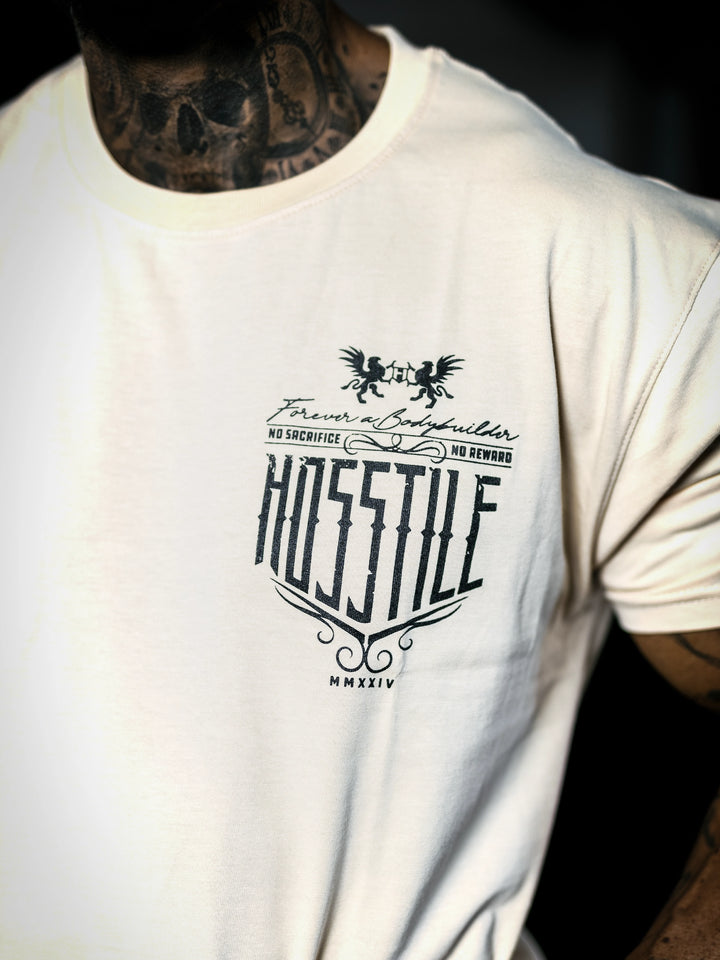 Bodybuilder Ben Chow standing in a gym wearing a t-shirt with text and graphics.#color_off-white