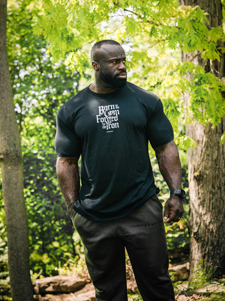 Bodybuilder Samson Dauda wearing the Forged Workout T-Shirt#color_black