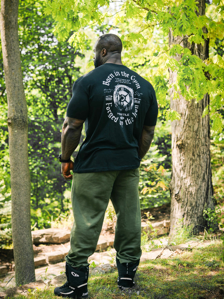Bodybuilder Samson Dauda wearing the Forged Workout T-Shirt#color_black