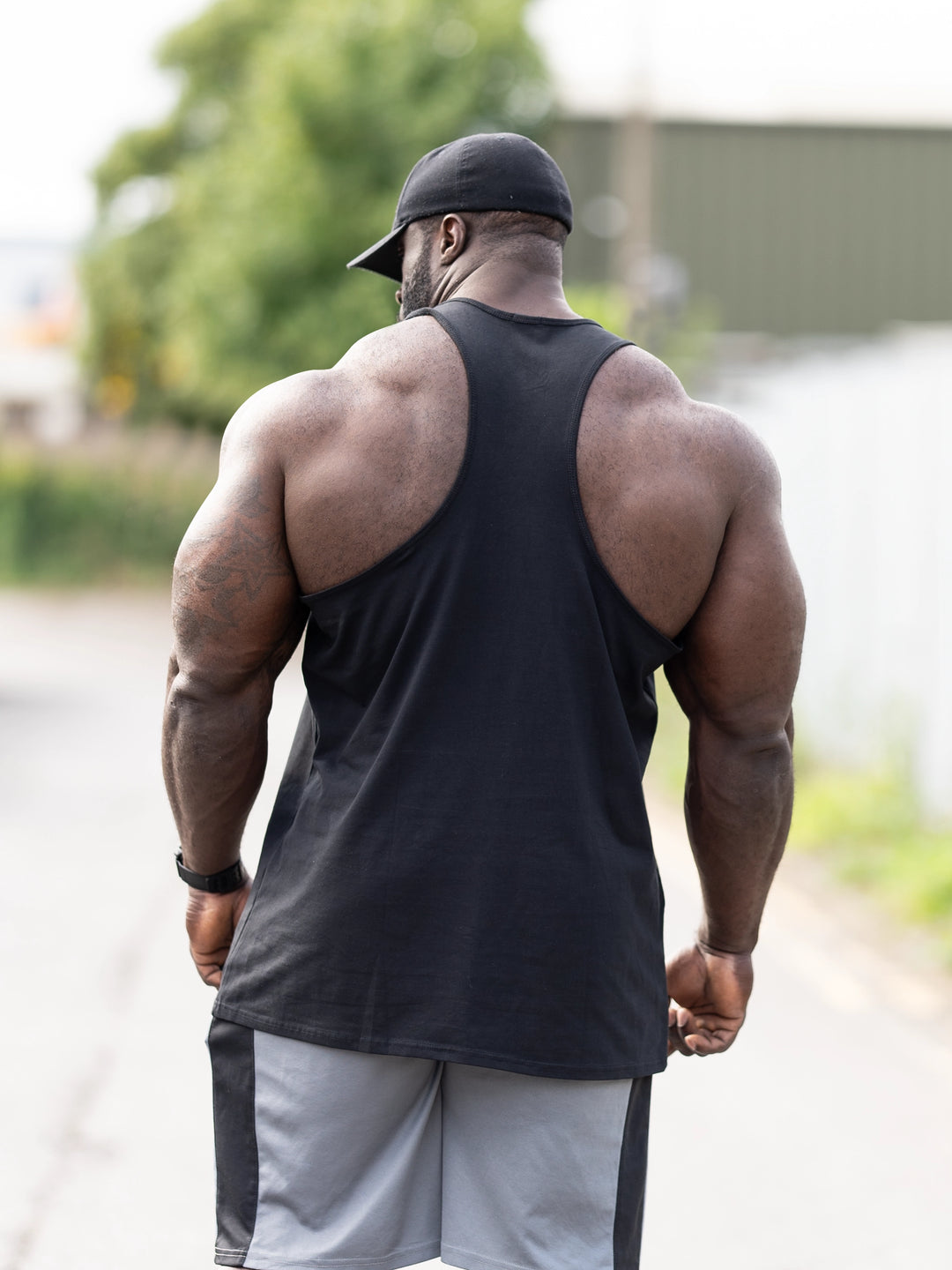 Foundation Men's Workout Tank Top - Black - Model Bodybuilder Samson Dauda#color_black