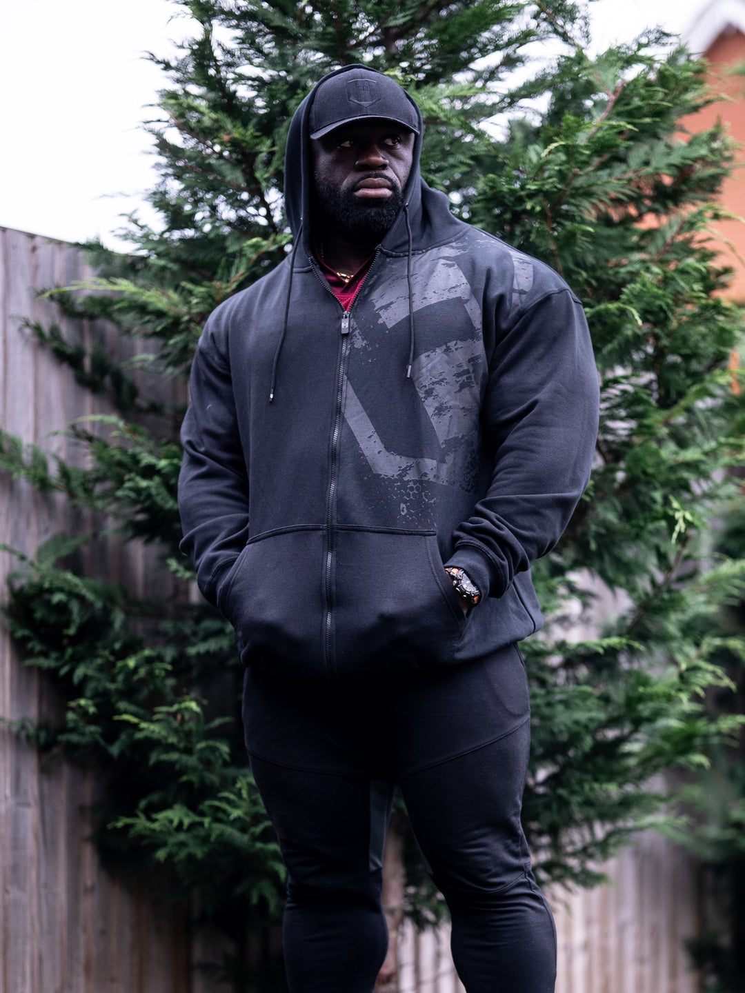 Samson Dauda wearing the Fractured Zip-Up Hoodie#color_black