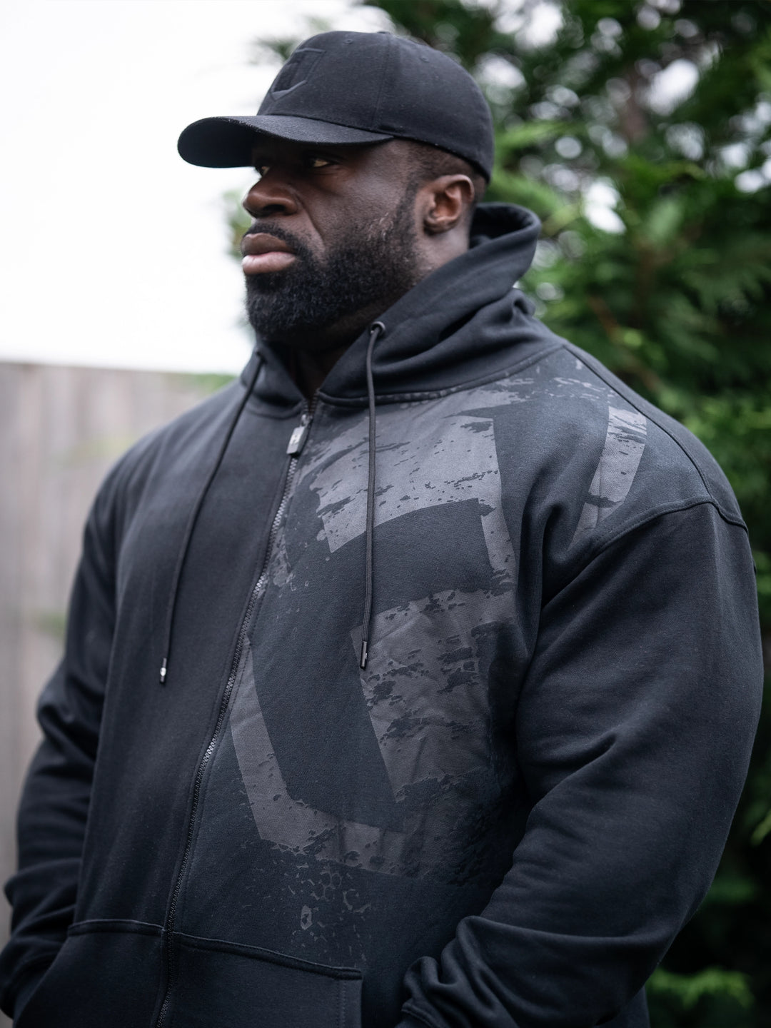 Samson Dauda wearing the Fractured Zip-Up Hoodie#color_black