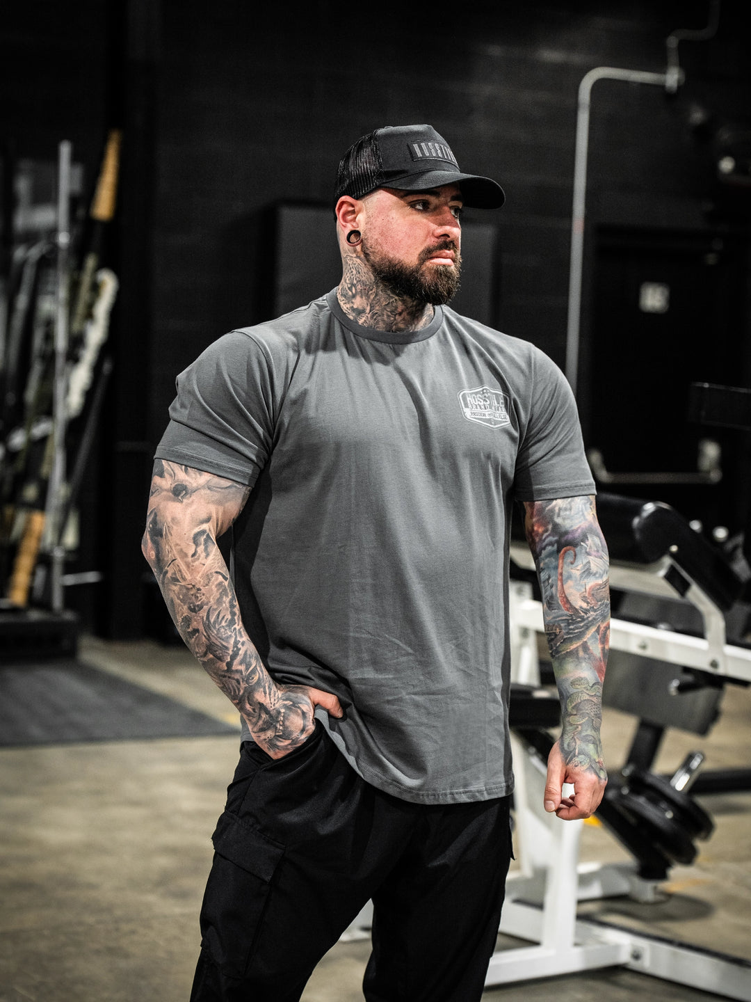 Bodybuilder wearing the Hosstile Garage Tee#color_gunship-grey