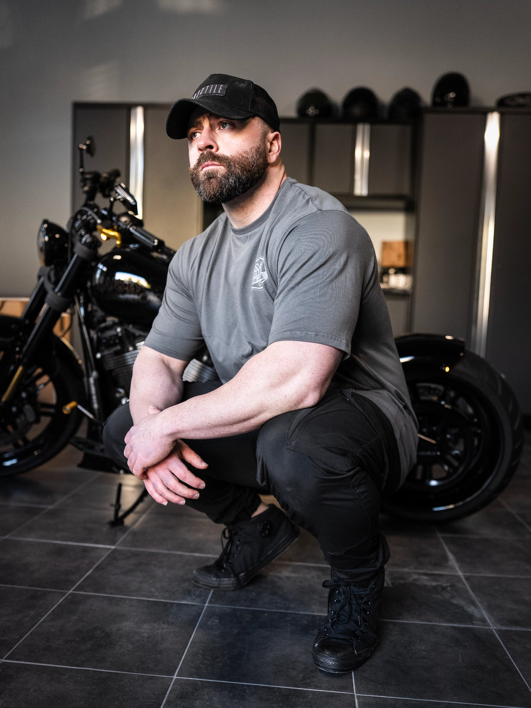 Bodybuilder wearing the Hosstile Garage Tee#color_gunship-grey