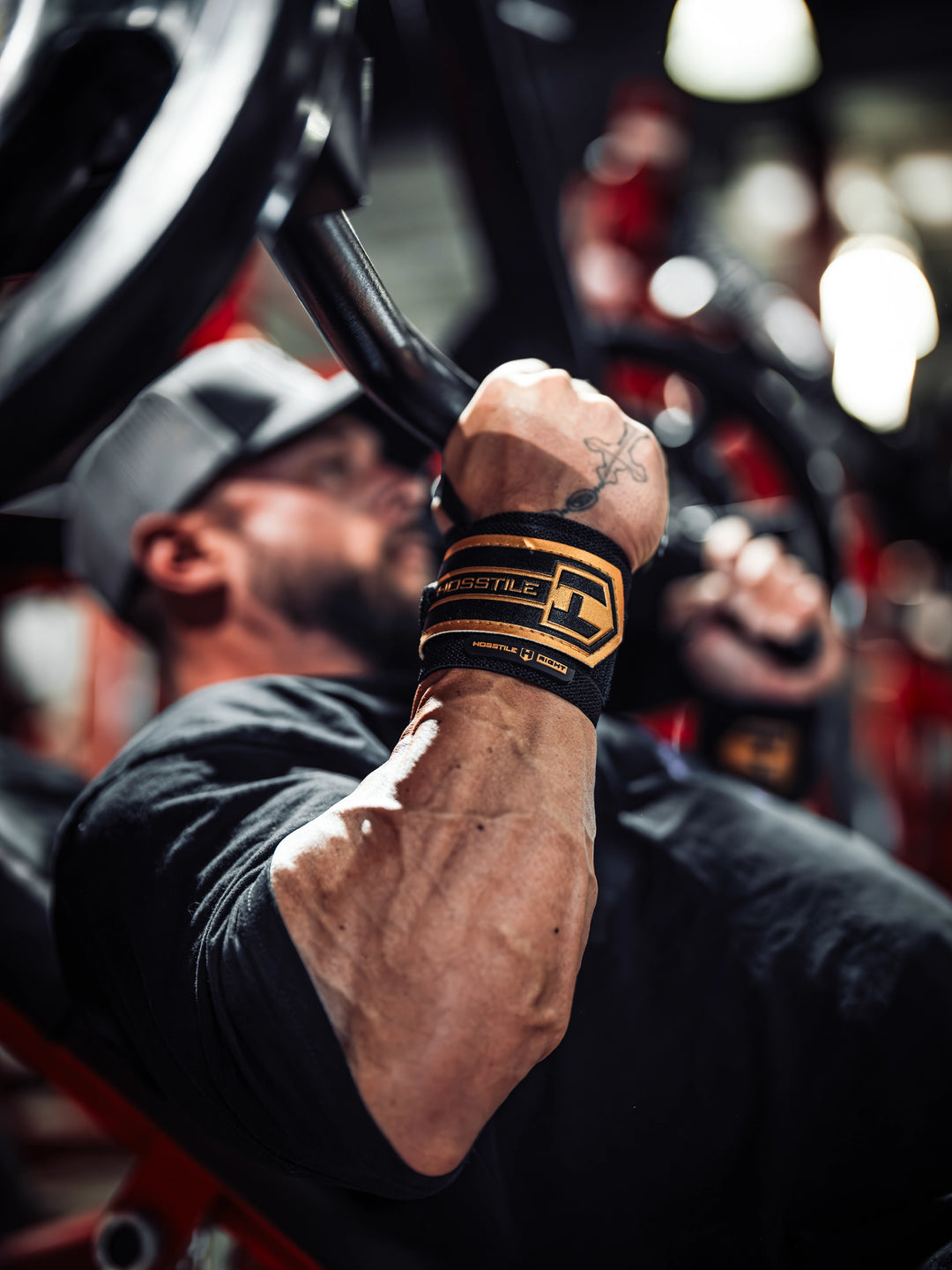 Bodybuilder wearing the Hosstile Heavy Duty Strength Wrist Wraps 