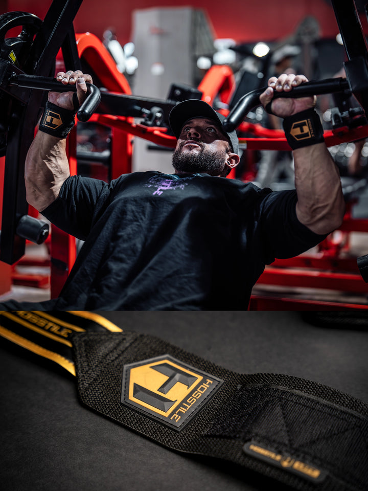 Bodybuilder wearing the Hosstile Heavy Duty Strength Wrist Wraps 