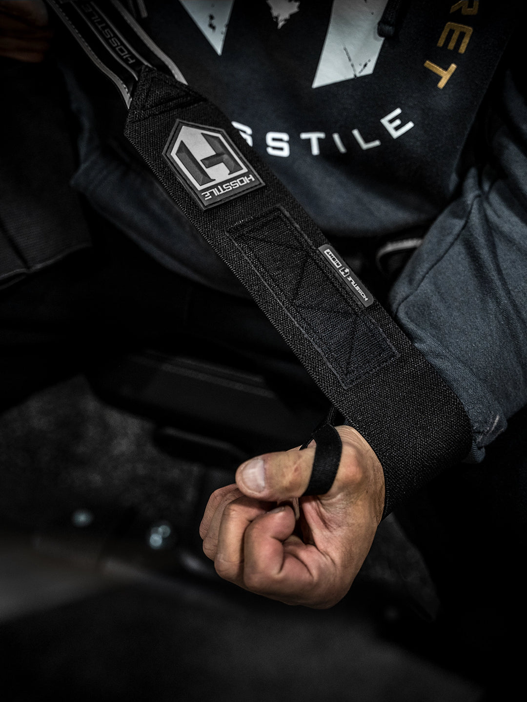 Bodybuilder wearing the Hosstile Regular Strength Wrist Wraps 