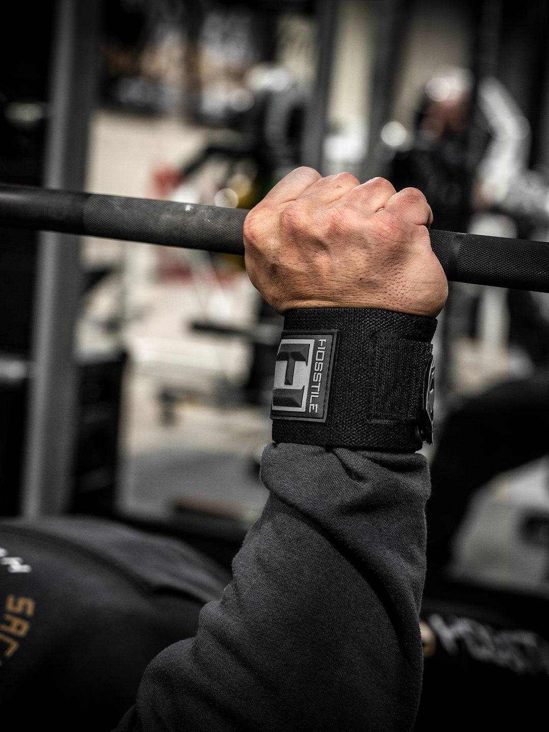 Bodybuilder wearing the Hosstile Regular Strength Wrist Wraps 