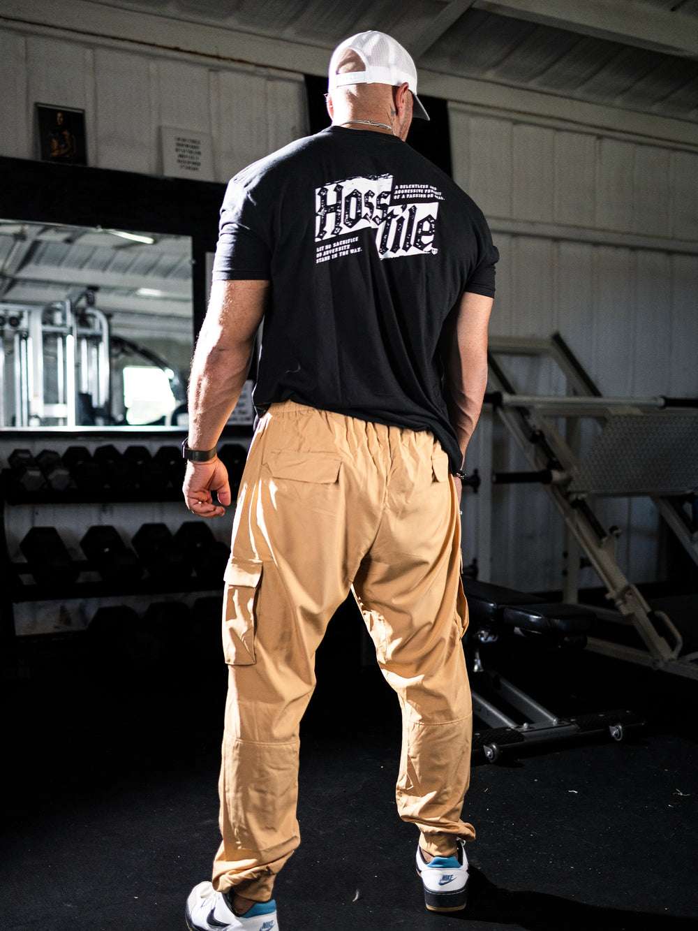 Bodybuilder wearing Gym Cargo Pants#color_khaki