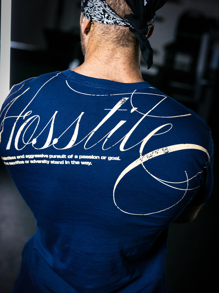 Bodybuilder Ben Chow standing in a gym wearing a t-shirt with text and graphics.#color_navy