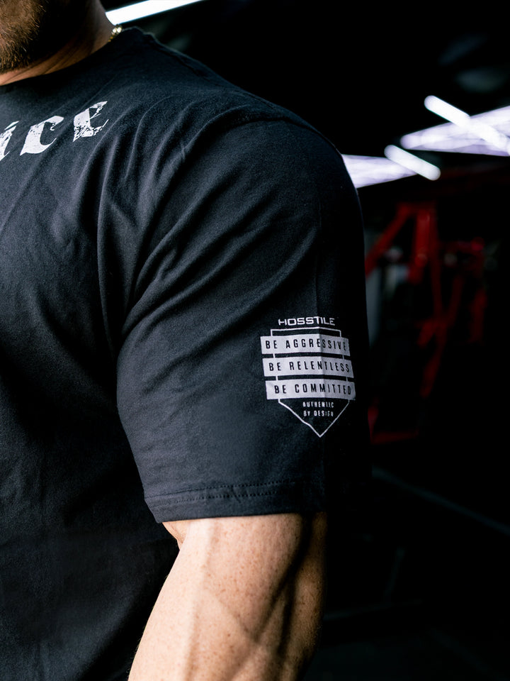 Martin Fitzwater wearing the Insignia t-shirt in a gym#color_black