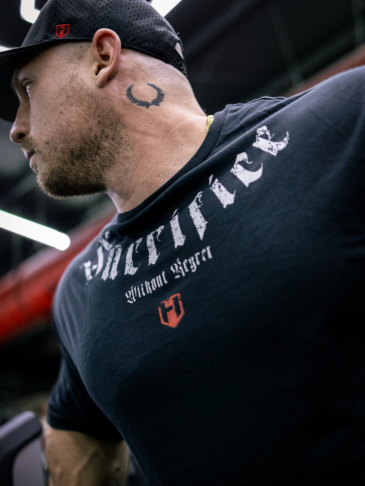 Martin Fitzwater wearing the Insignia t-shirt in a gym#color_black